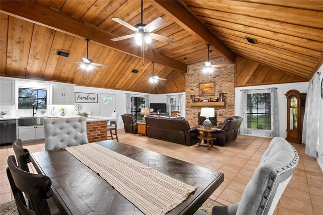 Open to the kitchen, you'll enjoy this roomy dining space. | Image 11