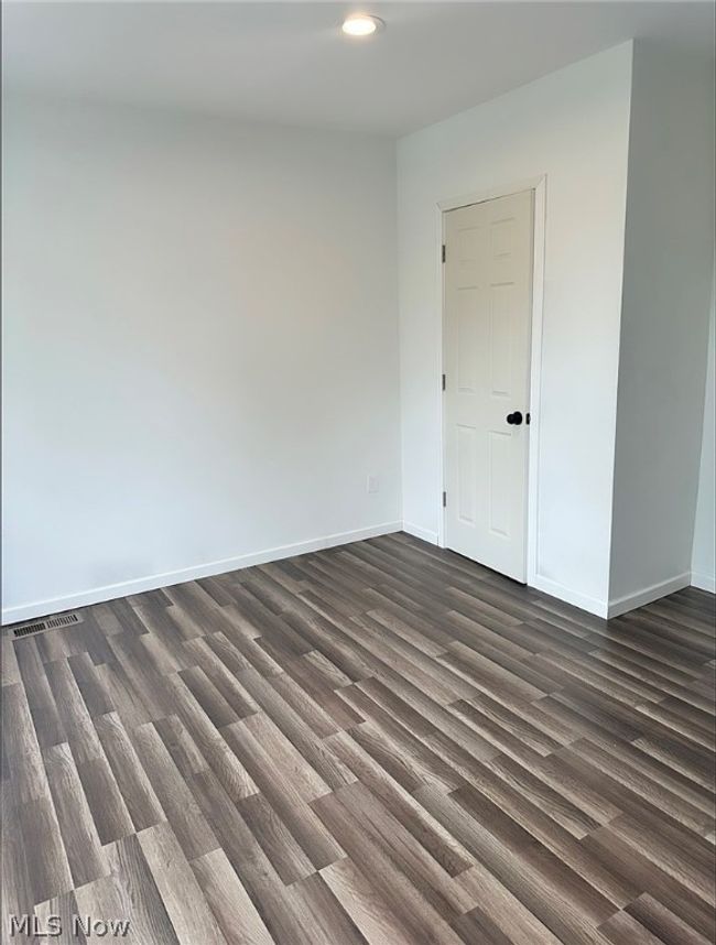 Empty room featuring dark hardwood / wood-style floors | Image 9