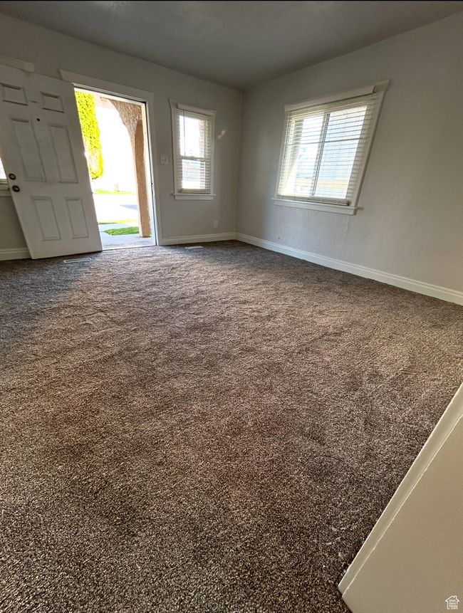 Carpeted empty room with baseboards | Image 9