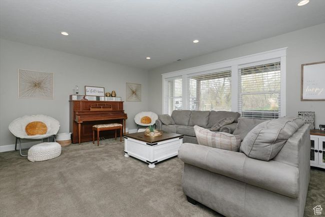 Carpeted living room with baseboards and recessed lighting | Image 59