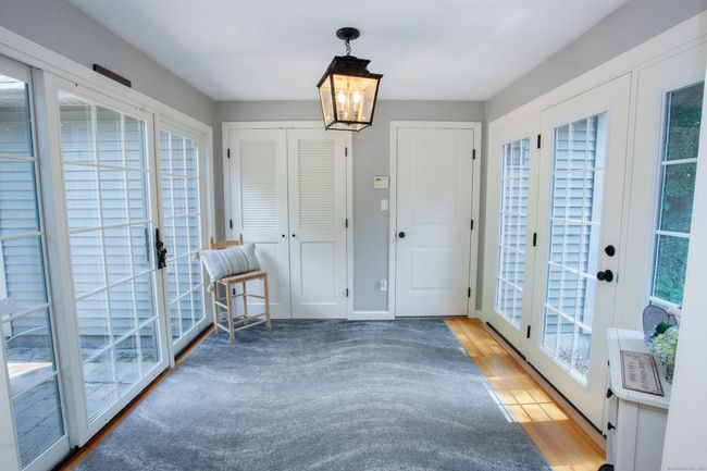 All glass breezeway is so inviting | Image 6