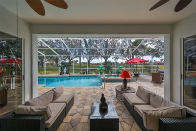 Covered Rear Lanai Custom Pavers, Outdoor Kitchen, Florida Screening | Image 2