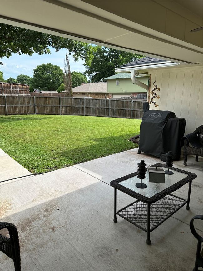View of patio featuring area for grilling and a fenced backyard | Image 28