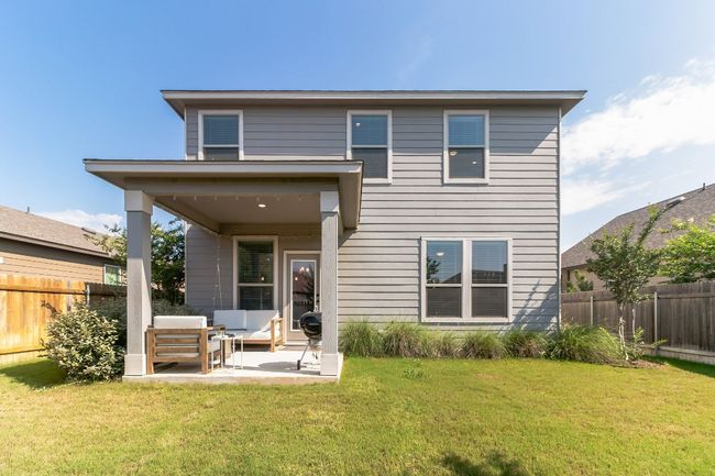 Back of house featuring a fenced backyard, a patio, and an outdoor living space | Image 28