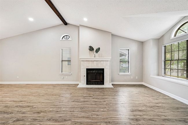 Updated tile surround fireplace, gas starter for a wood burning natural fireplace. This is an excellent feature given Austin's history of power outages during freezes. | Image 7
