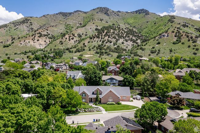 Aerial perspective of suburban area featuring a mountain backdrop | Image 102