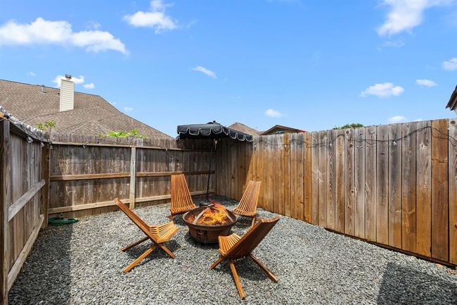 Private space created with a fire pit, surrounded by rocks, for late-night kickback and cigars. | Image 44