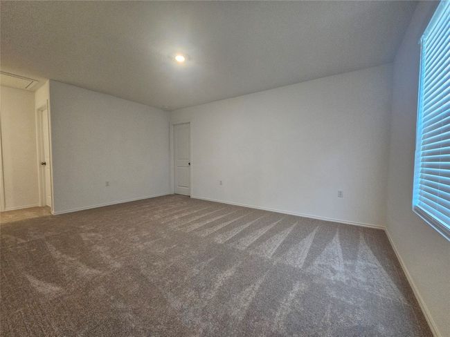 Carpeted spare room with baseboards | Image 12