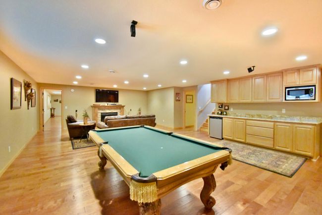 Gaming area with cabinetry | Image 23