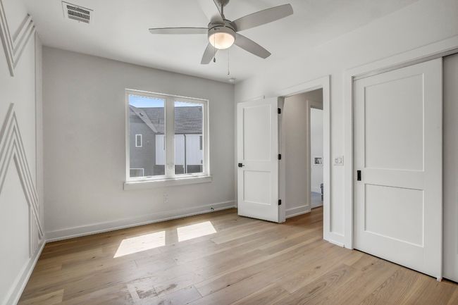 Unfurnished bedroom with light wood finished floors, baseboards, ceiling fan, and a closet | Image 16