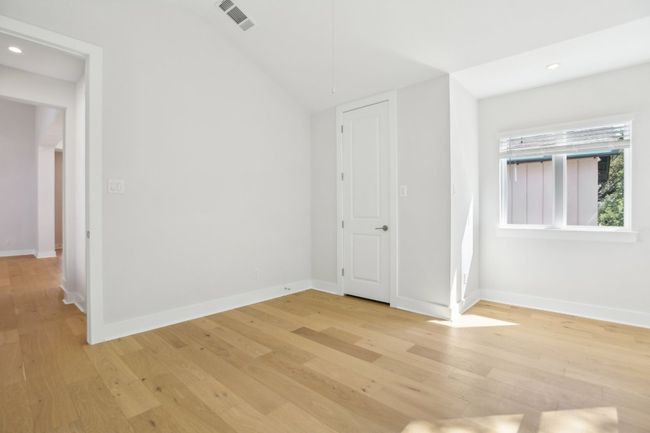 Unfurnished room featuring light wood-style floors, visible vents, and baseboards | Image 33