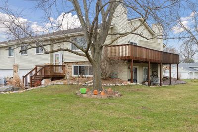 A large front and side yard. And don't miss this 23 foot long deck which gives you tons of outdoor space to enjoy. Home includes a one year home warranty too! | Image 3