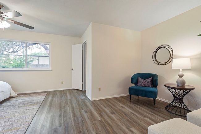 Nice sitting room as you enter the primary bedroom. | Image 14