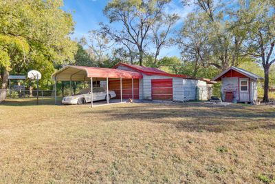 View of front of property featuring a front lawn and a carport | Image 2