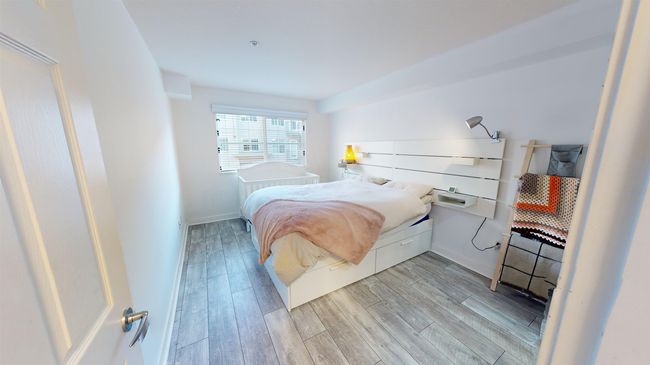 Bedroom featuring light wood-type flooring and baseboards | Image 12