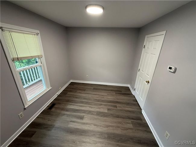 Spare room with baseboards and dark wood finished floors | Image 11