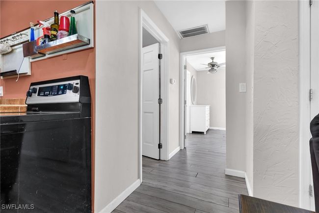 Hallway featuring baseboards, and visible vents | Image 17