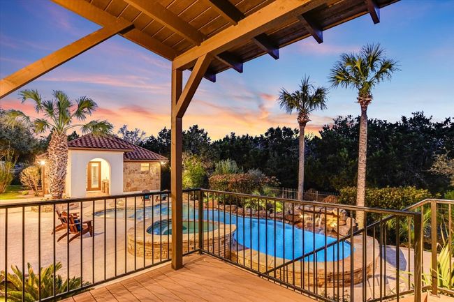 Covered deck/porch right off the primary suite overlooking the scenery and backyard oasis. | Image 24