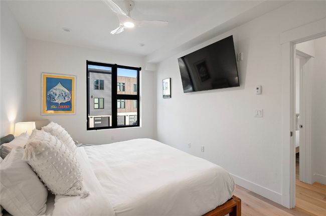 Bedroom featuring ceiling fan and light hardwood / wood-style flooring | Image 18