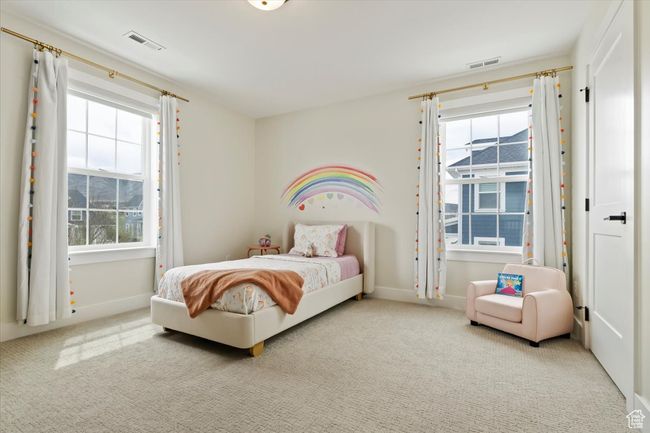 Carpeted bedroom featuring visible vents and baseboards | Image 22