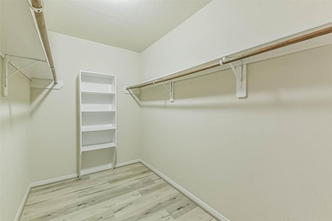 Secondary Primary Bedroom's 11 x 6 Walk-in Closet. | Image 25