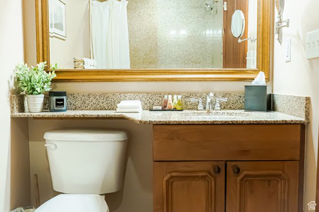 Bathroom featuring toilet and vanity | Image 29