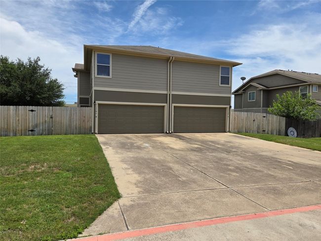 View of front of house with a garage and driveway | Image 4