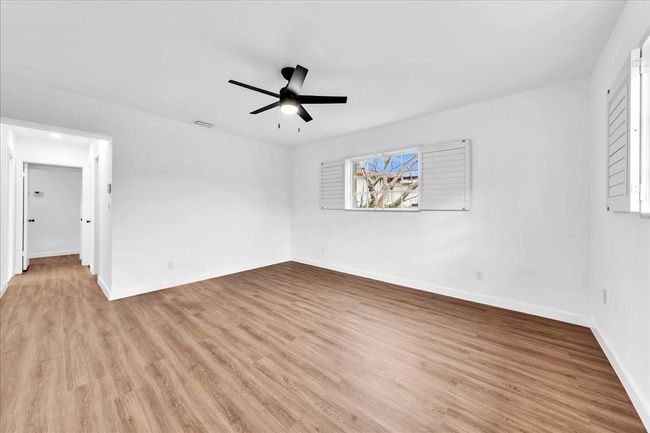 with Walk-in Closet, Plantation Shutters & New Ceiling Fan | Image 22