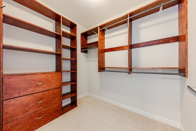 Walk in closet with carpet | Image 18