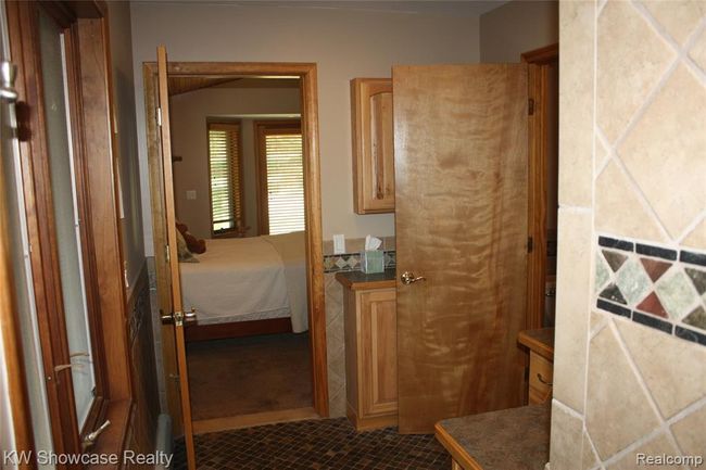 Master bathroom, looking back into the bedroom. | Image 28