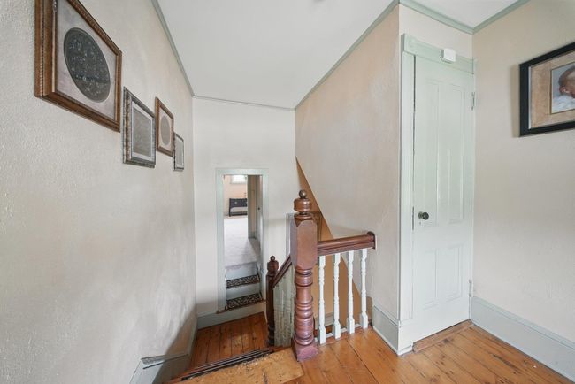 Stairs featuring hardwood / wood-style flooring | Image 25
