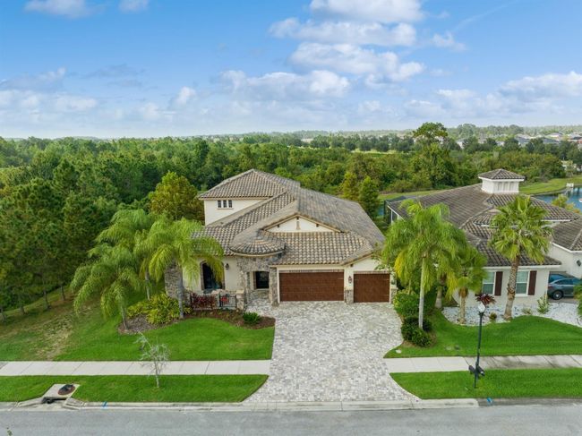 7183 Heather Sound Loop, House other with 5 bedrooms, 4 bathrooms and null parking in Wesley Chapel FL | Image 2