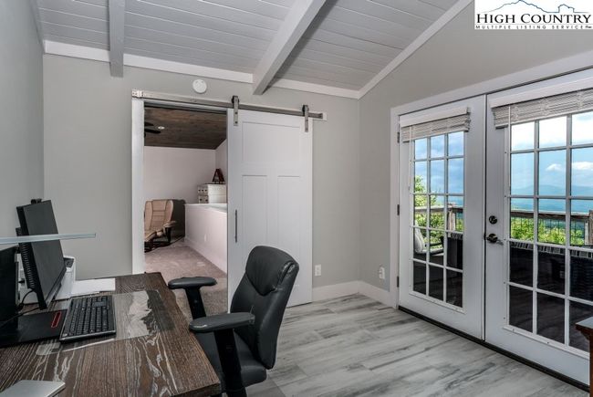 Office with French doors leading to deck. | Image 16
