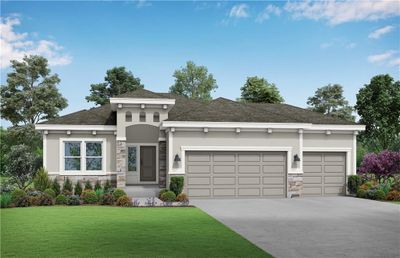 View of front of home featuring a front lawn and a garage | Image 1