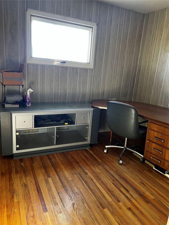 Unfurnished office with dark wood-style floors and plenty of natural light | Image 58