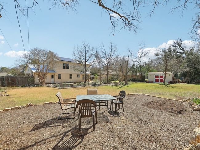 View of yard with an outdoor structure and fence | Image 36