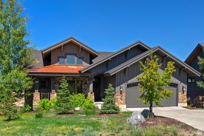 Craftsman-style home with a garage and a porch | Image 1