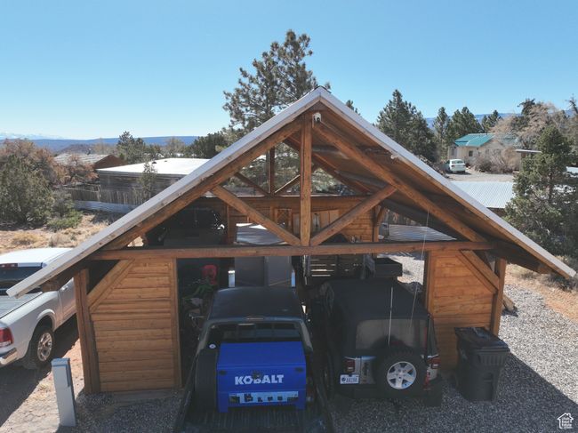 Exterior space featuring a carport and metal roof | Image 35