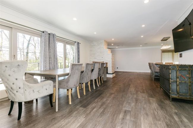 Dining area featuring baseboards, recessed lighting, ornamental molding, and wood finished floors | Image 5