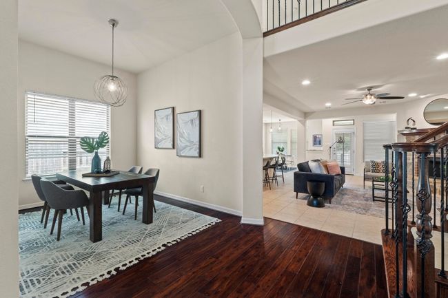 Dining space with hardwood / wood-style floors, plenty of natural light, recessed lighting, a ceiling fan, and a chandelier | Image 18