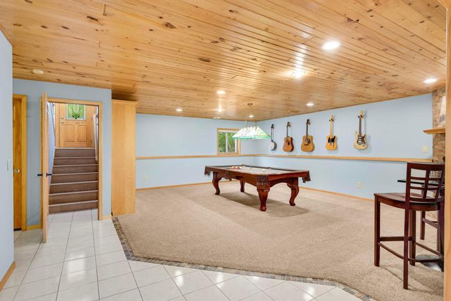 Retreat down to the finished Lower Level and enjoy a game room, living room, 2 additional bedrooms, 3/4 bath and storage! | Image 22