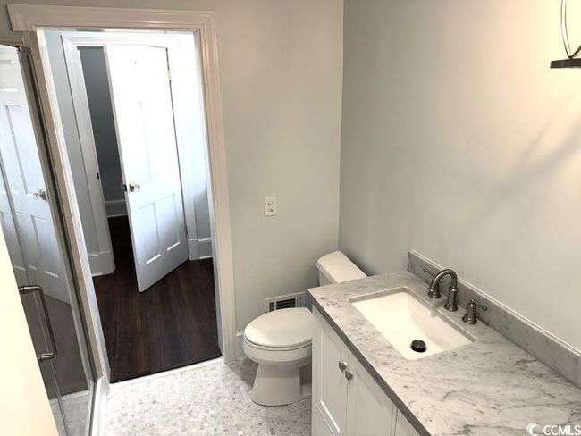 Bathroom with toilet and vanity | Image 29