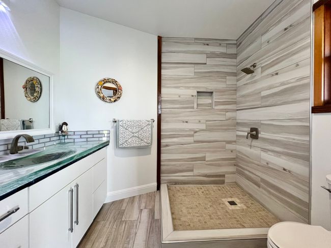 Downstairs bathroom, tiled, beautiful seamless sink. | Image 19