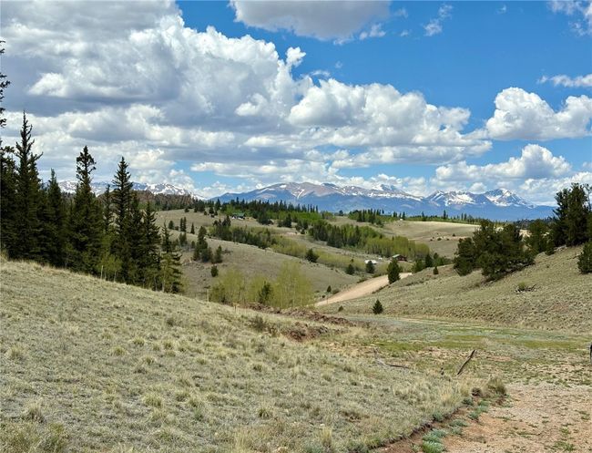 View of mountain backdrop with rural landscape | Image 32