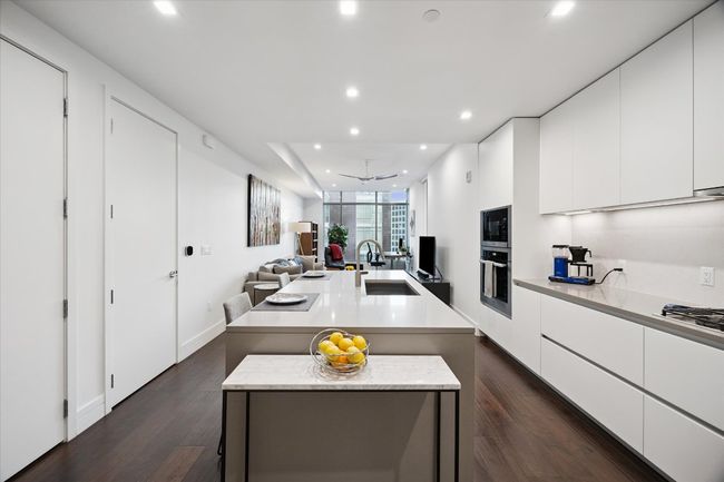 Chefs kitchen with state of the art appliances and large kitchen island | Image 5