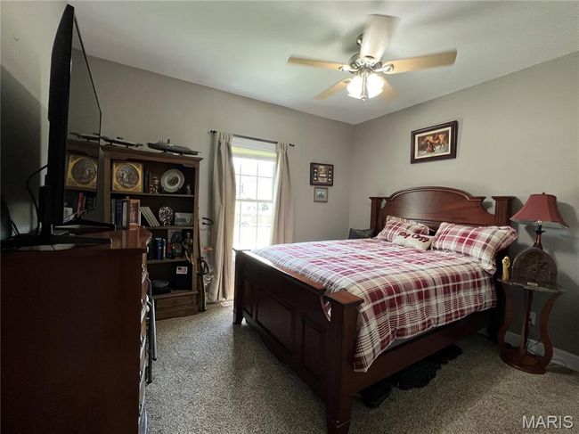 Bedroom featuring carpet floors and ceiling fan | Image 17