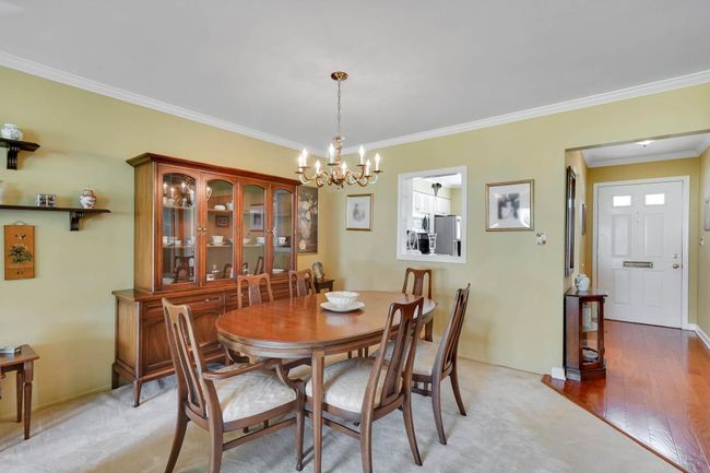 Dining space with a chandelier and crown molding | Image 4