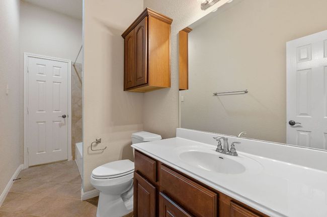 Full bath with vanity, toilet, tile floors | Image 19