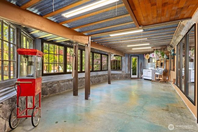 Sunroom in the lower level. | Image 24