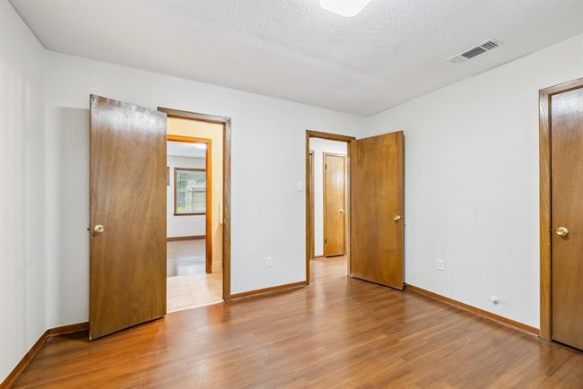 Bedroom #1 while standing at the front window easy to see the jack and jill 1/2 bath and entry to hall | Image 23